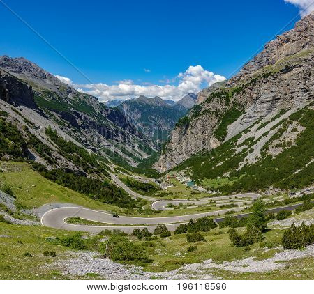 Top view of serpentine road and galleries of Stelvio Pass from above. Bormio side