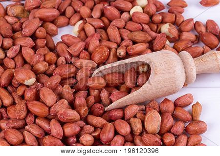 roasted peanuts with spatula close up photo