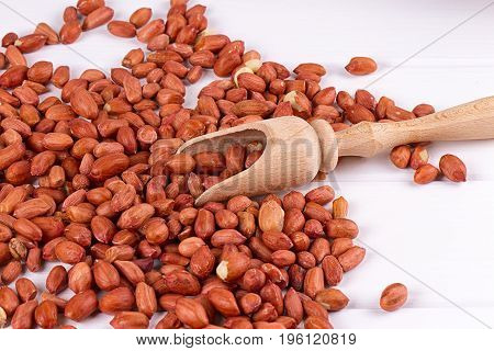 roasted peanuts with spatula close up photo