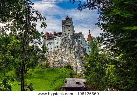 BRASOV TRANSYLVANIA ROMANIA - JUNE 28 2017: The medieval Bran Castle where the ruler Vlad Tepes-Dracula stayed during campaigns and hunting. Later it belonged to the Romanian Queen Maria.