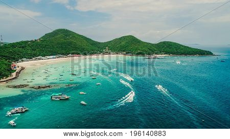 Koh Larn island and his tropical beaches. Beautiful landscape of Thailand sea and boats.Speed boats on crystal clear water. Pattaya city,Thailand.
