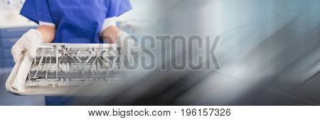 Digital composite of Close up of dentist with tray and blurry grey transition
