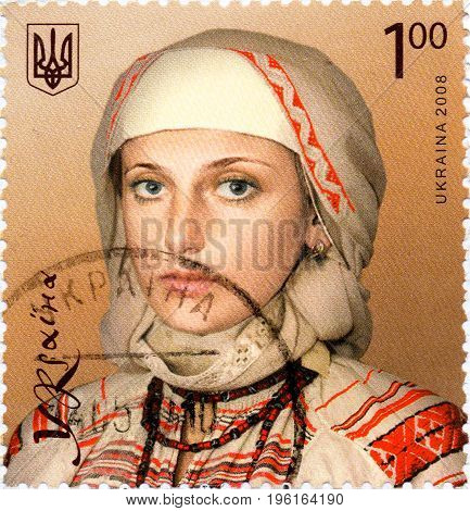UKRAINE - CIRCA 2017: A postage stamp printed in Ukraine shows Girl in national costume circa 2008