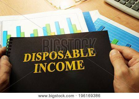 Disposable income written on a front of note.
