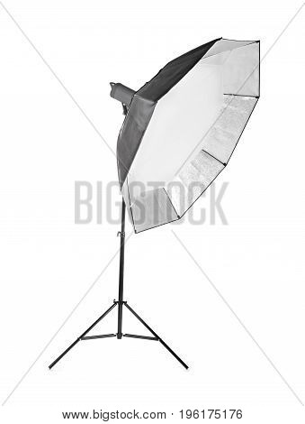 Professional studio octobox, isolated on a white background. Studio lighting. A long and black octobox. Studio equipments. Studio flash with soft-box on white background.