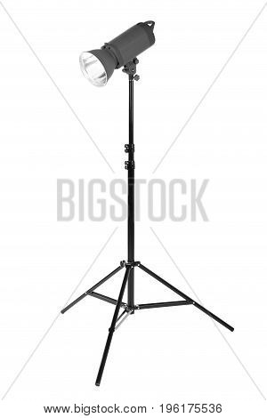 Modern powerful photographic flash. Studio lighting, isolated on the white background. Professional black equipment. Studio spotlight. Photo equipment.