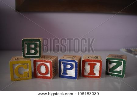 Several wooden cubes waiting for color inspiration