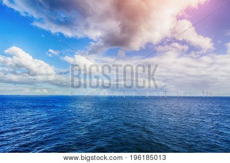 Alternative energy - shot of row of floating wind turbines