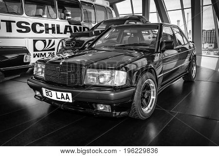 STUTTGART GERMANY- MARCH 19 2016: Compact executive car Mercedes-Benz 190E 2.3 AMG (W201) 1984. The owner of Ringo Starr (ex-musician and drummer of the Beatles). Black and white. Mercedes-Benz Museum.