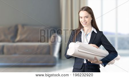 Young Beautiful Business Woman And Creative Designer Standing Over Blured Interior Background