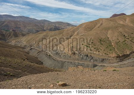 Panorama Of High Atlas Mountain Range And Serpentine Road From On Of Pass, Morocco, Africa