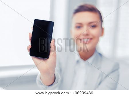 business, office, school and education concept - smiling businesswoman with smartphone in office
