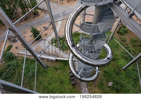 Treetop Walkway lignting Sightseeing trail in tree crowns. Wooden construction with a slide in the middle. Touristic place and unique constructionc. Treetop Walkway in Lipno Czech Republic