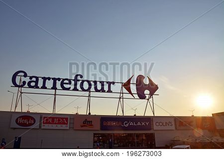 Timisoara Romania - July 20 2017: The Carrefour supermarket logo outside a shopping mall in Timisoara Romania. Shot taken on July 20th 2017
