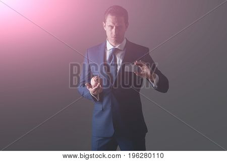 Confident Businessman Holding Piggy Bank And Bank Card