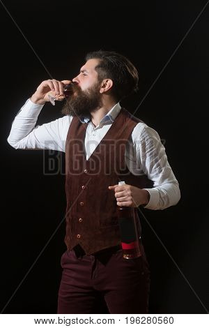 Hipster With Bottle Drinking Glass Of Red Wine