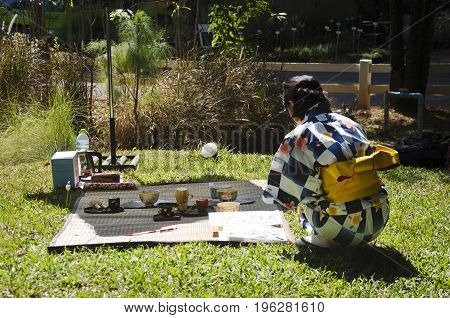 Japanese Women Making Sado Chanoyu Or Japanese Tea Ceremony, Also Called The Way Of Tea At Outdoor