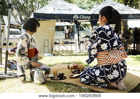 Japanese Women Making Sado Chanoyu Or Japanese Tea Ceremony, Also Called The Way Of Tea At Outdoor
