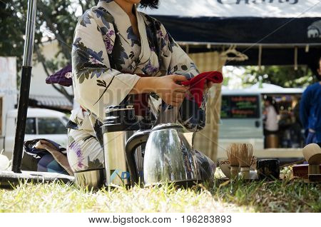Japanese Women Making Sado Chanoyu Or Japanese Tea Ceremony, Also Called The Way Of Tea At Outdoor