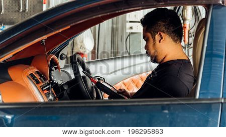 Checking A Car Engine Obd For Repair At Car Garage
