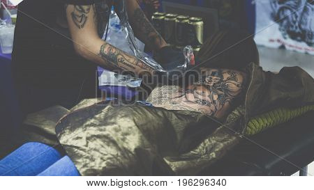 Tattoo Artist Drawing Art On Body