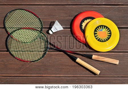 summer fun sport set, frisbee, badminton racquets, playing outside