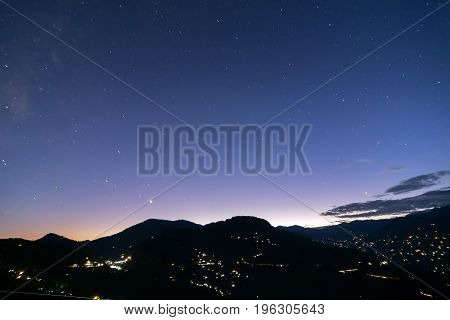 Sky at dusk at Rinchenpong sikkim India. With Rinchenpong city at the foreground the evening dusk sky is lit with remaining light coming from behind Himalayan Mountains India.
