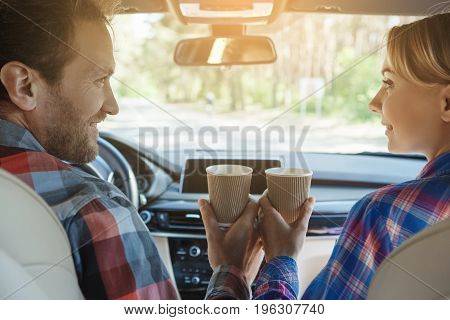 Travel by car family ride together couple drinking coffee
