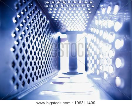 An interesting and unusual view from inside the grater for vegetables