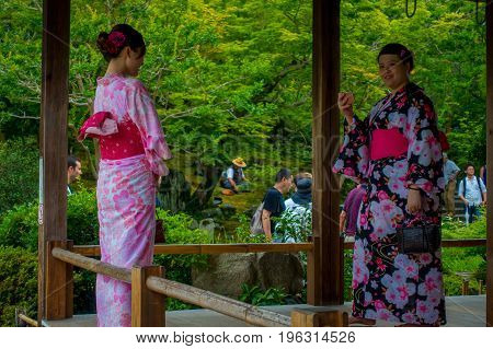 KYOTO, JAPAN - JULY 05, 2017: Unidentified people taking selfies of the Hojo Hall of Tenryu-ji in the Arashiyama district of Kyoto, Japan.