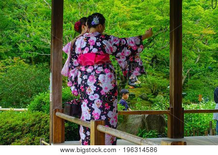 KYOTO, JAPAN - JULY 05, 2017: Unidentified people taking selfies of the Hojo Hall of Tenryu-ji in the Arashiyama district of Kyoto, Japan.