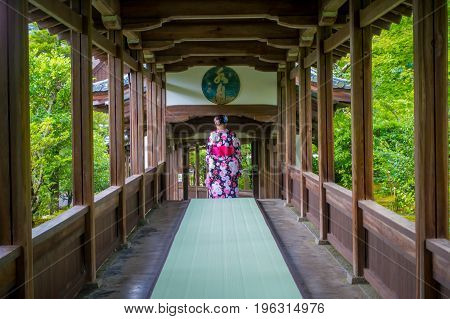 KYOTO, JAPAN - JULY 05, 2017: Unidentified woman walking through the Hojo Hall of Tenryu-ji in the Arashiyama district of Kyoto, Japan.