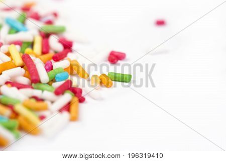 Sugar sprinkle dots decoration for cake and bekery a lot of sprinkles as a background. Wiith copyspace