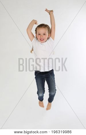 Cute blonde little girl barefoot white background