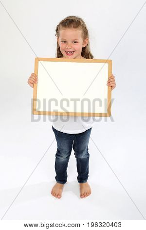 Cute little girl bare feet and with a bare panel smiling