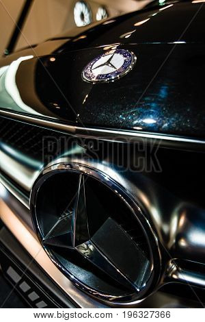 BERLIN - JANUARY 24 2015: Showroom. Hood ornament and emblem of a mid-size luxury car Mercedes-Benz CLS 63 AMG. Produced since 2013.