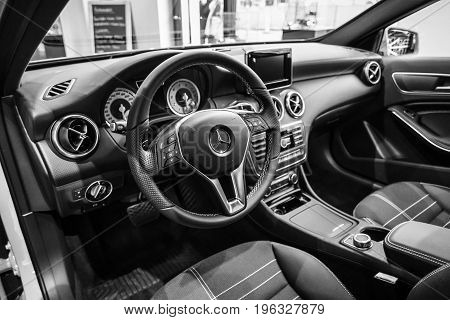 BERLIN - JANUARY 24 2015: Showroom. Interior of a compact car Mercedes-Benz A200 CGI BE. Black and white. Produced since 2013.