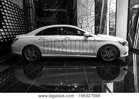 BERLIN - JANUARY 24 2015: Showroom. Compact executive car Mercedes-Benz CLA200. Black and white. Produced since 2013.