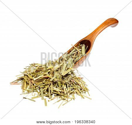 Dried Sweetgrass Hierochloe on the wooden spoon. Macro photo.
