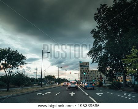 STRASBOURG FRANCE - 30 jun 2017: Entrance to Strasbourg from Germany with the RHENA hospital clinic and scary clouds above the city