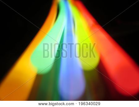 Glow sticks movement in dark rainbow colots