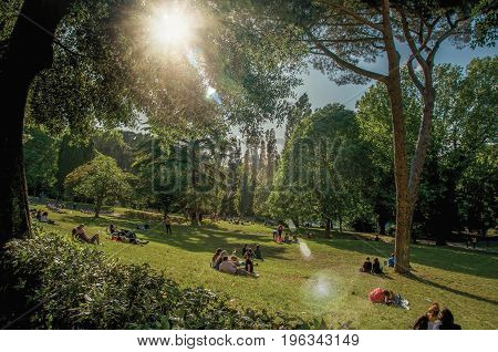 Roma, Italy - May 19, 2013. View of people in park of the Villa Borghese on a sunny day in Rome, the incredible city of the Ancient Era, known as 