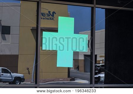 Las Vegas - Circa July 2017: Green Cross sign. The green cross is a common symbol used in the marijuana community. A number of states have legalized pot for recreational use IIII