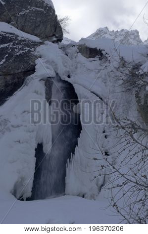 small waterfall in formazza valley during winter