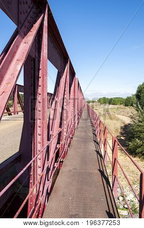 Old iron bridge over the River Esla, in Leon Province, Spain