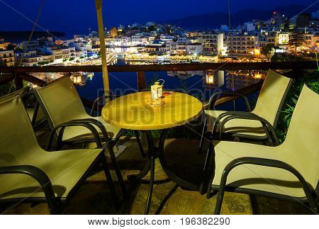 Aghios Nikolaos night view - picturesque town in the eastern of island Crete built on the northwest side of the peaceful bay of Mirabello