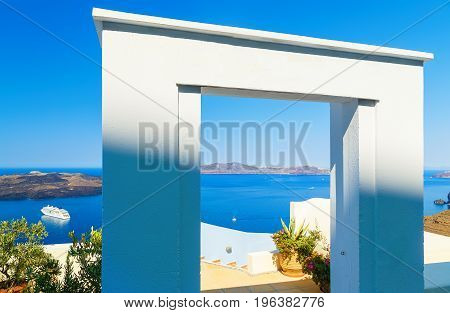 Gate to the sea - Santorini island. View on steps leading down and overlooking the Calero and cruise ship in the Bay