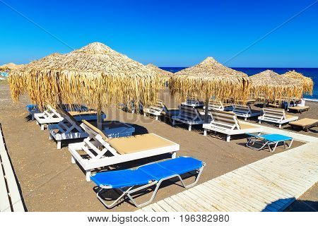 Santorini Perissa beach with black sand Santorini island