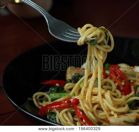 Spicy spaghetti with many kind of herbs.