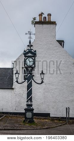 Street clock with compass rose in Ullapool Scotland